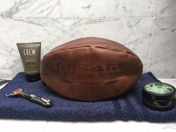 Ram Rugby vintage leather wash bag in brown with hand-stitched rugby ball design, durable and stylish toiletry pouch