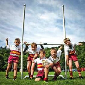 Young rugby players with a RAM micro rugby goal post