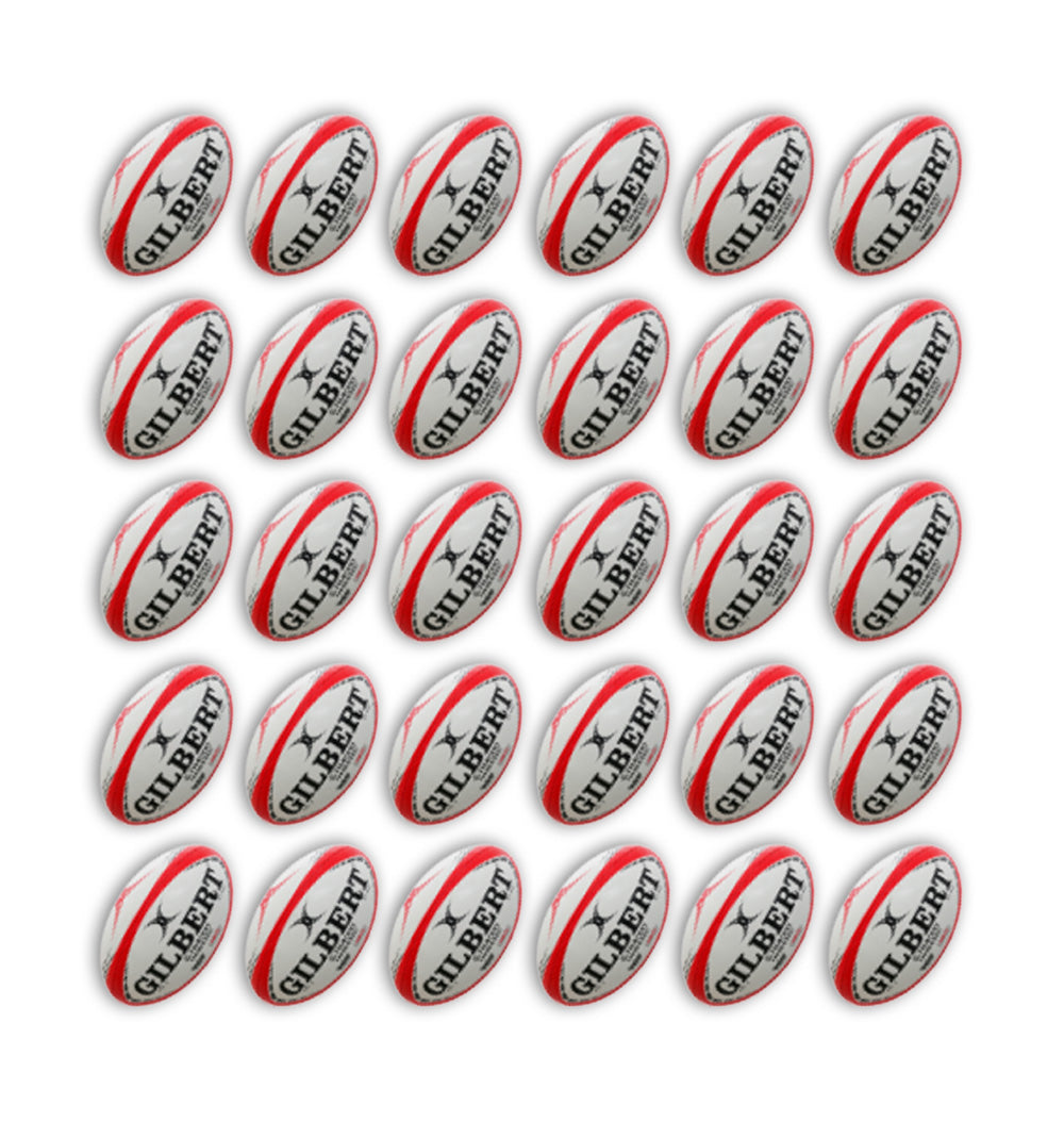 Close-up of Gilbert G-TR4000 trainer rugby balls in team colors stacked inside two large breathable ball bags for training use