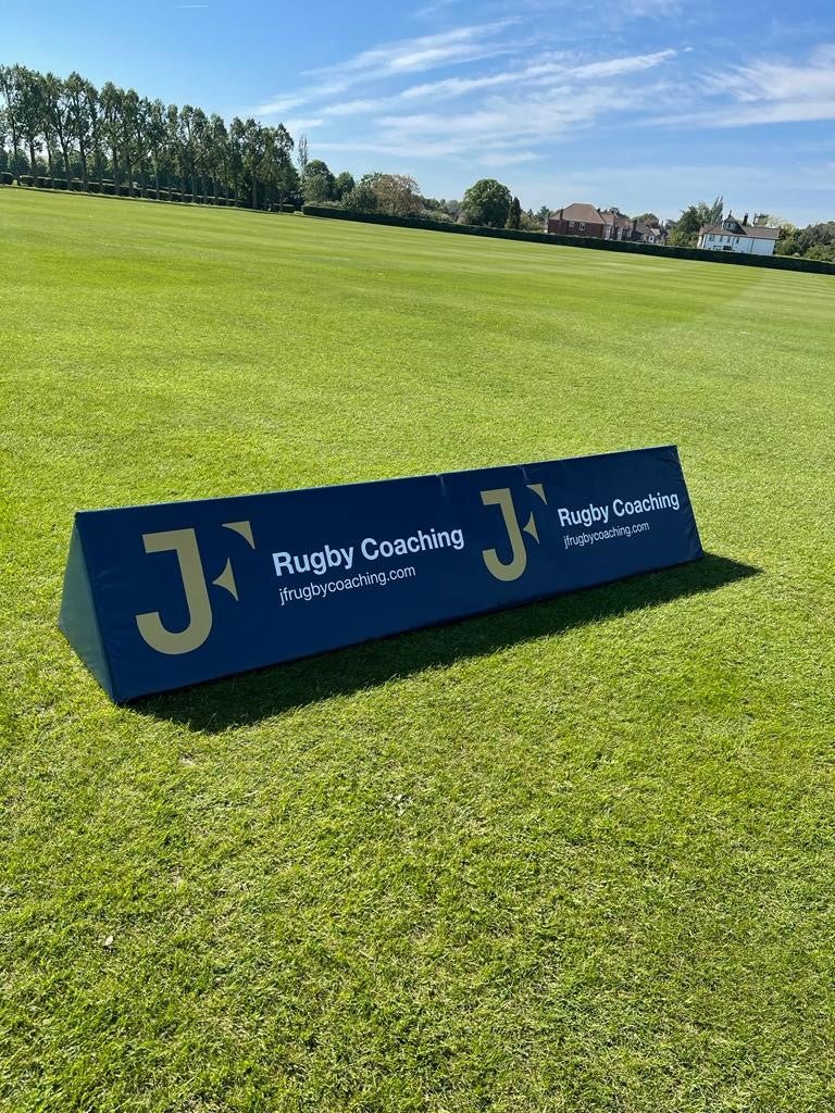 Ram Rugby high-visibility custom advertising corner flag foam wedge in bright yellow, designed for rugby field branding and safety.