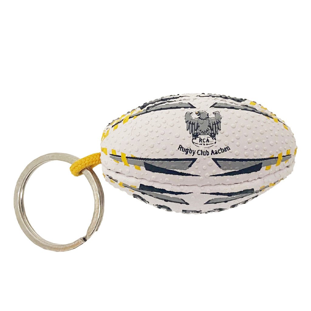 Ram Rugby custom printed rugby ball keyring in black rubber with club logo, promotional gift ideal for sports events and giveaways