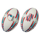 Stack of 15 Ram Rugby Victor Raider custom match balls in white with personalized logos and text printed for teams