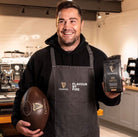 Close-up of Ram Rugby Custom Vintage Leather Heritage Rugby Ball Size 5 showing embossed logo on brown leather surface with classic stitching