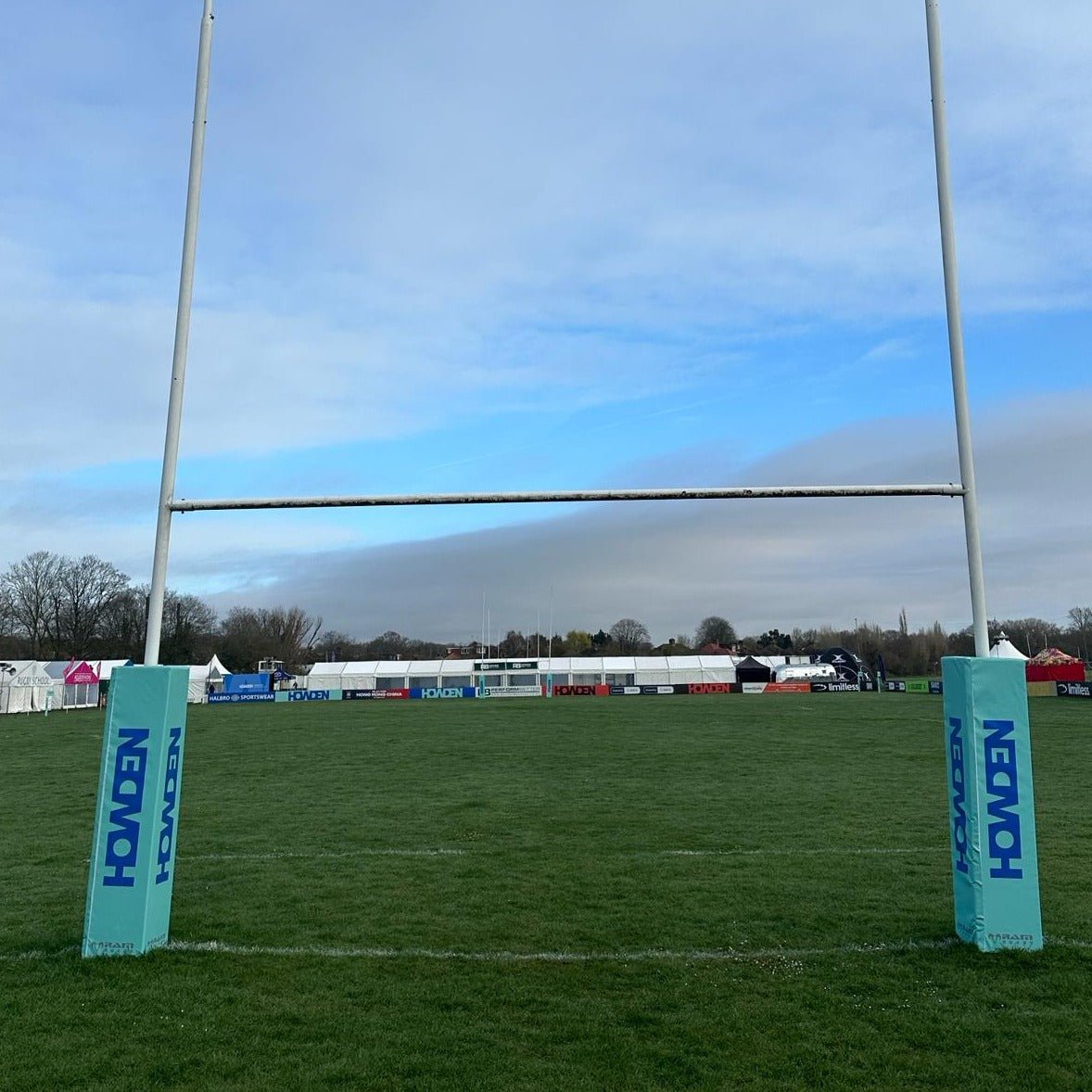 Ram Rugby 12-inch post protectors with rigid corner flags and corner poles in bright red for rugby pitch safety and marking