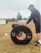 Ram Rugby Rip-Roller Tackle Bag in blue and black with sturdy straps, designed for dynamic rugby training drills