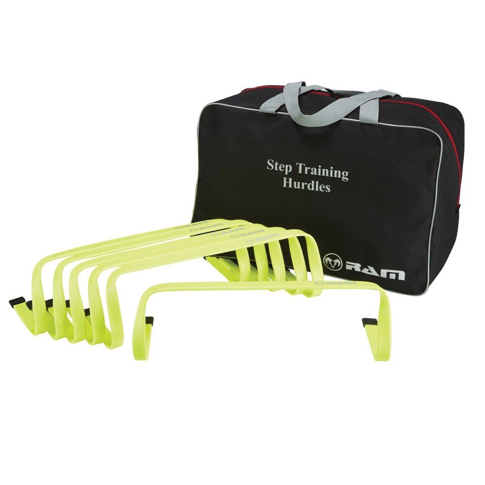 Six bright orange Ram Rugby agility hurdles arranged on green grass for speed and footwork training in sports practice.